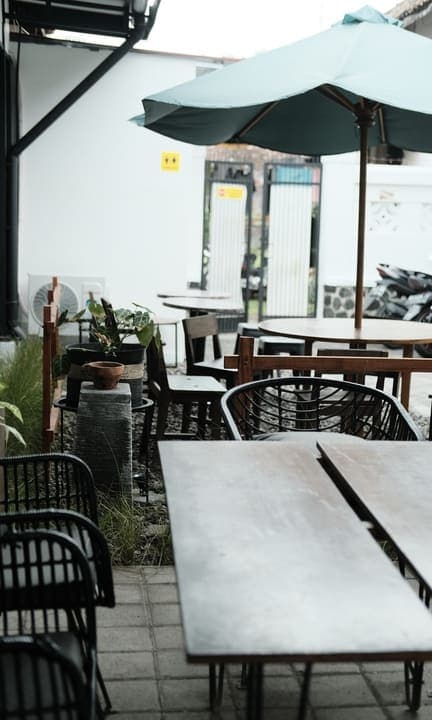 Comfortable outdoor seating area with garden umbrella