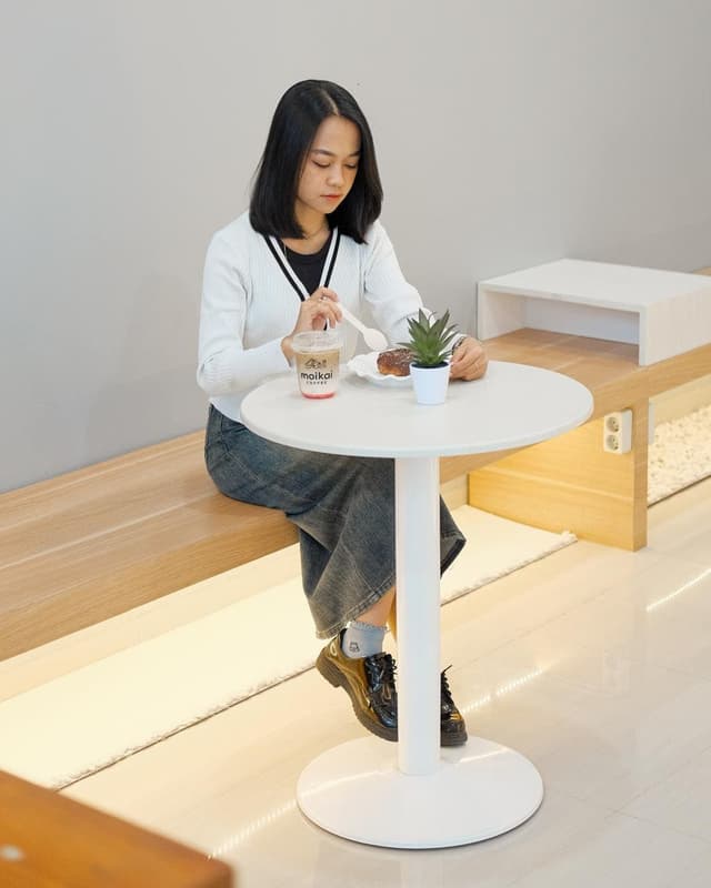 Enjoying a quiet moment with coffee and pastry