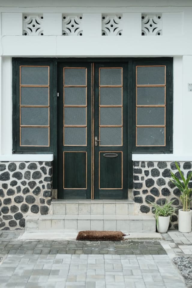 Aesthetic vintage wooden door and stone wall detail